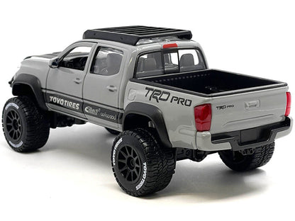 2023 Toyota Tacoma TRD PRO Off Road Pickup Truck Cement Gray with Black Hood and Roofrack "Maisto Design" Series 1/27 Diecast Model Car by Maisto-2